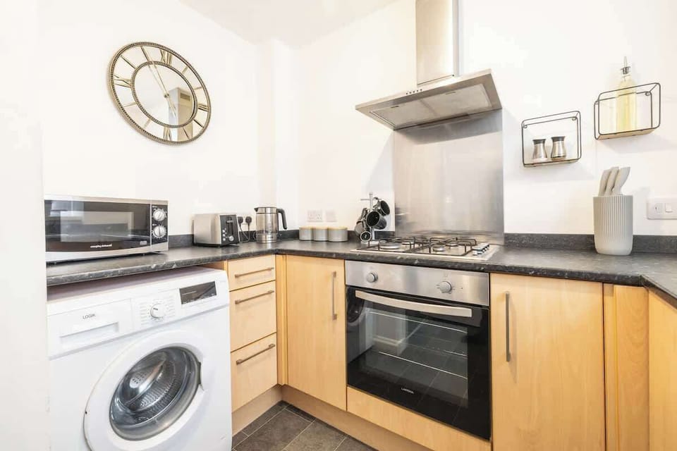 Fully equipped kitchen with modern appliances and ample counter space
