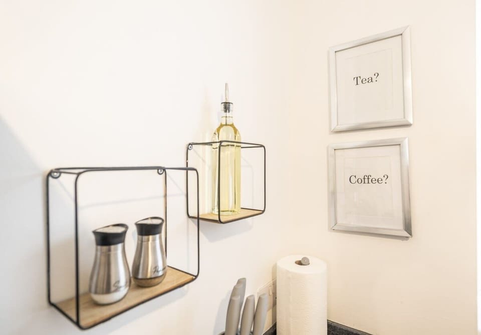 Decorative kitchen shelf with coffee essentials and modern accessories
