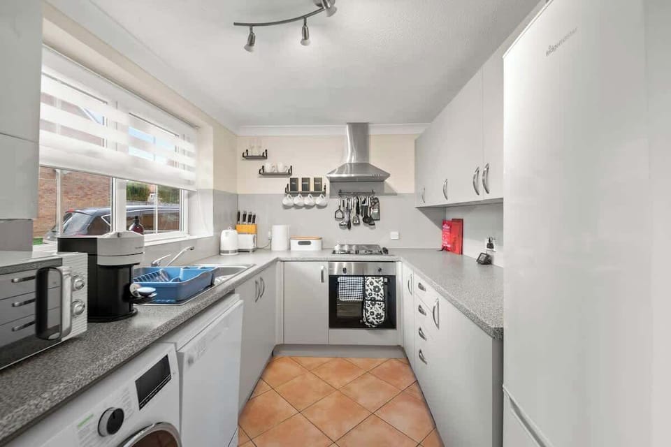 Fully equipped kitchen with ample counter space and modern appliances
