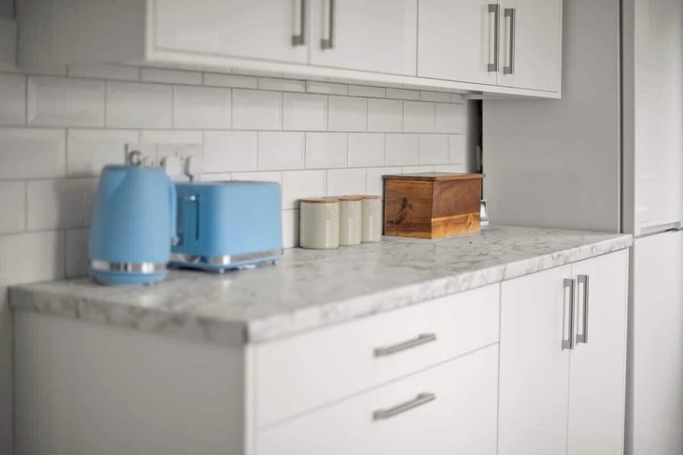 Stylish countertop with toaster, storage jars, and neat organization design