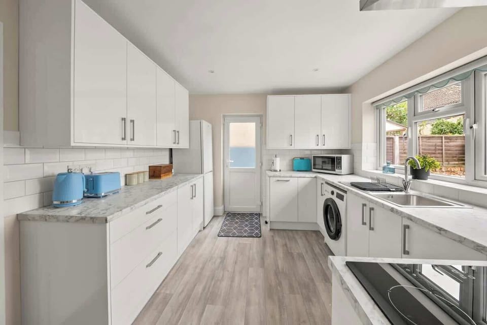 Modern kitchen with sleek cabinets ample space and functional layout