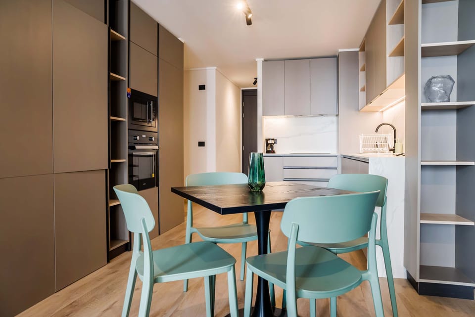 Chic and modern kitchen with dining area, perfect for cozy meals in a stylish setting.