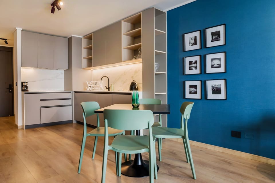 Stylish kitchen with modern amenities and a cozy dining area, perfect for intimate meals.