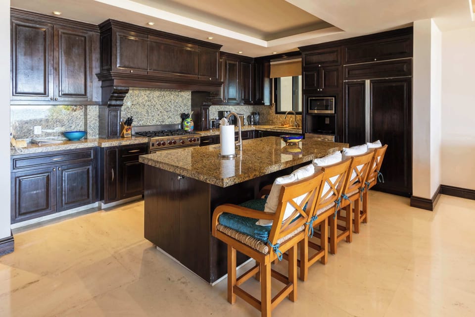 Gourmet kitchen designed for creating memories — enjoy slow breakfasts together or cook a romantic dinner with the sea as your backdrop.