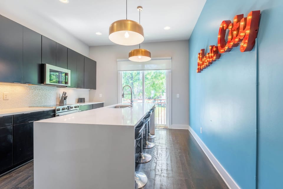 Sleek kitchen with modern appliances and ample prep space