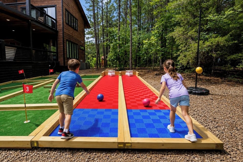 Another one-of-a-kind feature you won't find anywhere else in Broken Bow—our custom-built outdoor bowling alley and mini golf course. Designed exclusively for endless fun, friendly competition, and unforgettable memories right outside your cabin door