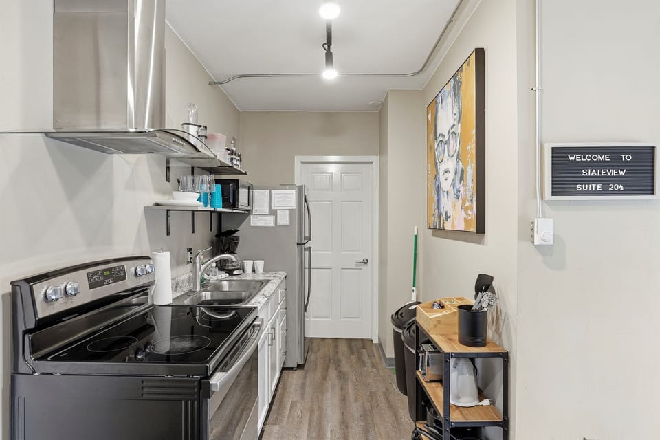 A compact, well-equipped kitchen perfect for quick meals or relaxed cooking.