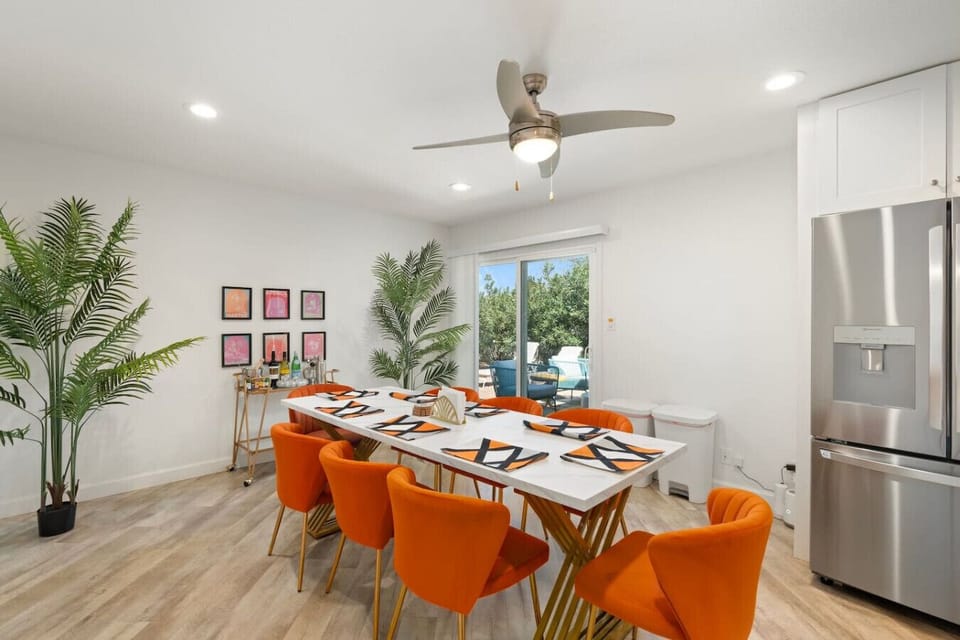 Spacious dining area with a table that comfortably seats 8—ideal for family meals or entertaining guests.