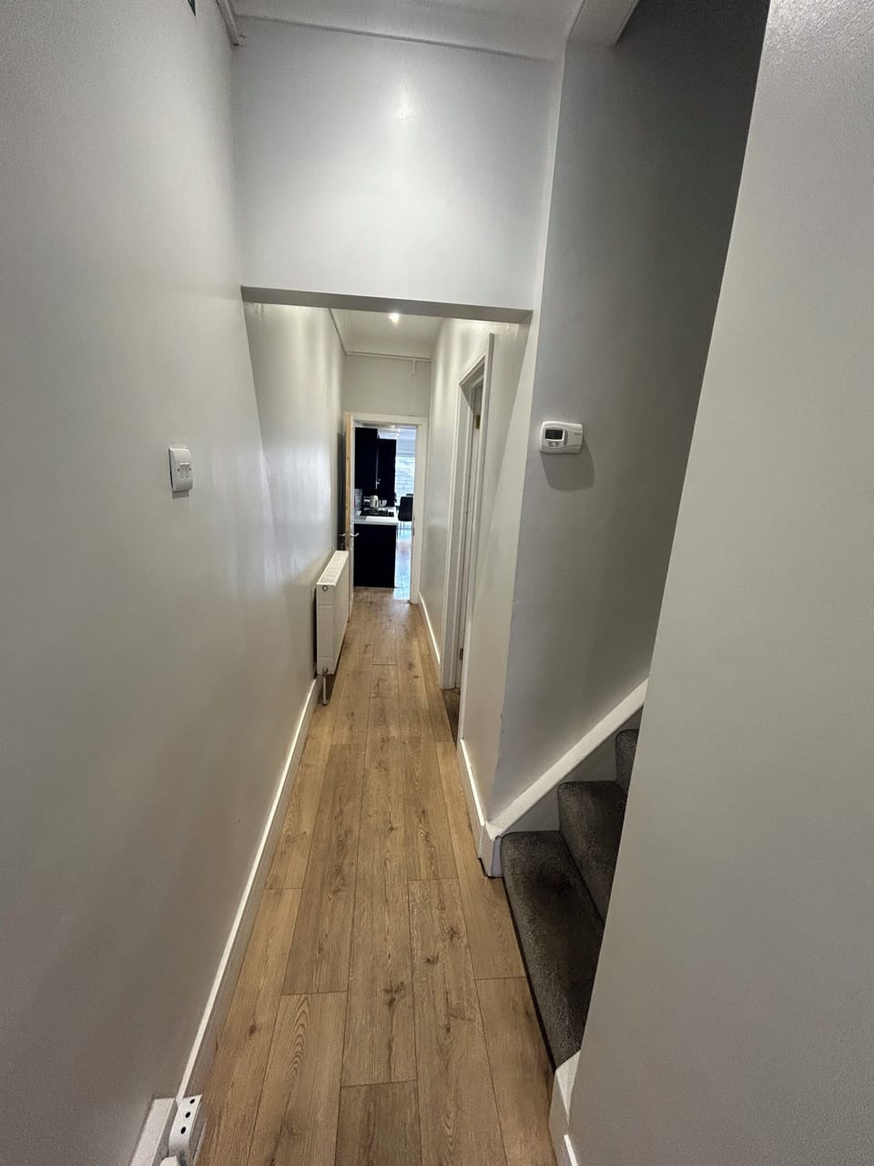 Ground floor corridor to a bedroom & Kitchen