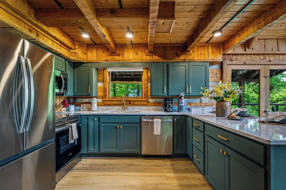Velvet green cabinets paired with gold accents—where elegance meets everyday comfort.