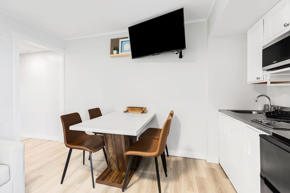 Kitchenette is open to the living room and also features  smart TV