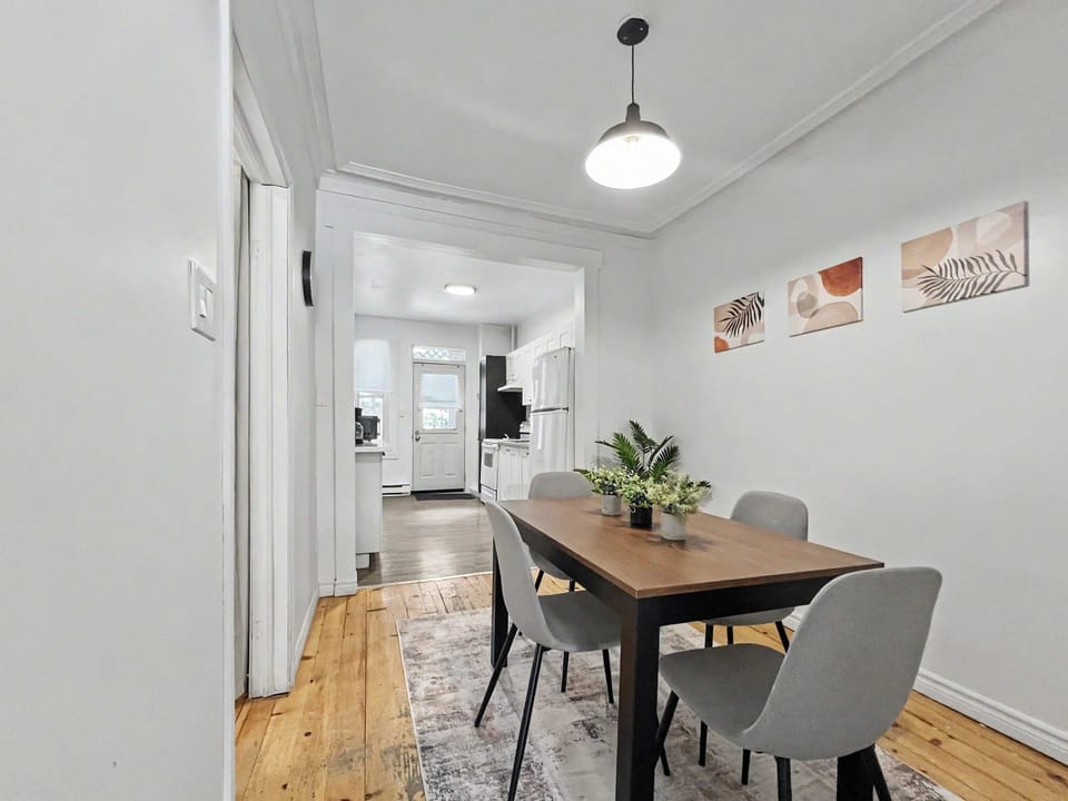 Gather around the table for a home-cooked meal or a morning coffee in this bright, open-concept dining space.