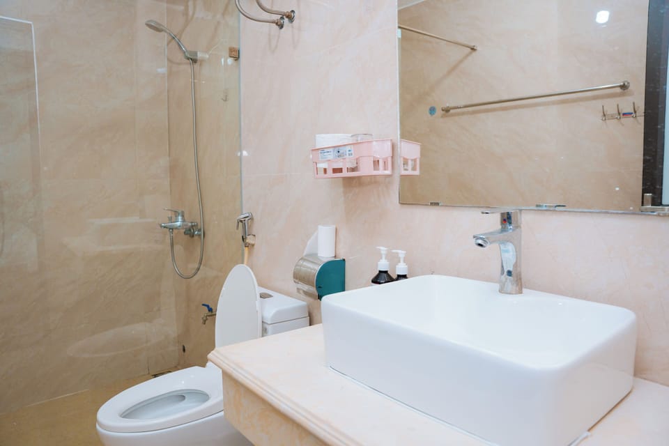 Deluxe Room, Multiple Beds, Balcony, City View | Bathroom | Hair dryer, towels, soap, shampoo