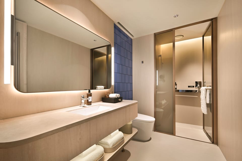 Shower, hair dryer, slippers, towels