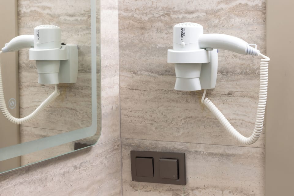 Standard Room, City View | Bathroom amenities | Hair dryer, towels, soap, shampoo