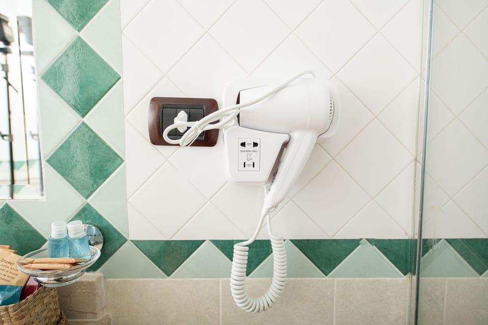 Hair dryer, slippers, towels, soap