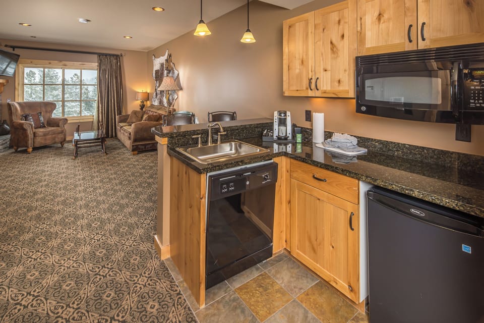 Rustic kitchen nook with mini fridge, microwave, dishwasher I Main Level