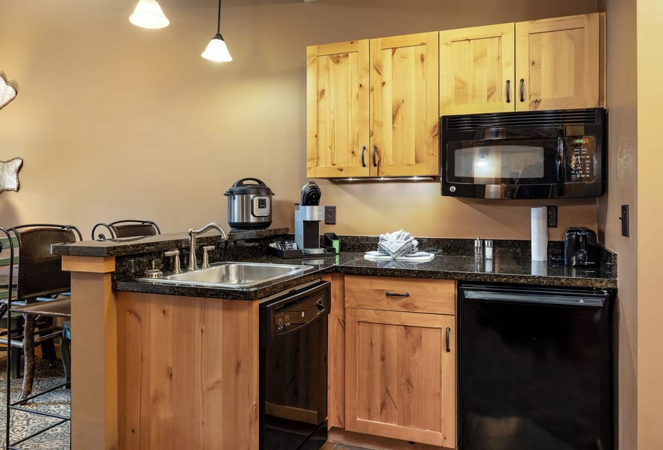 Kitchenette with several appliances for a home cooked meal | Main Level