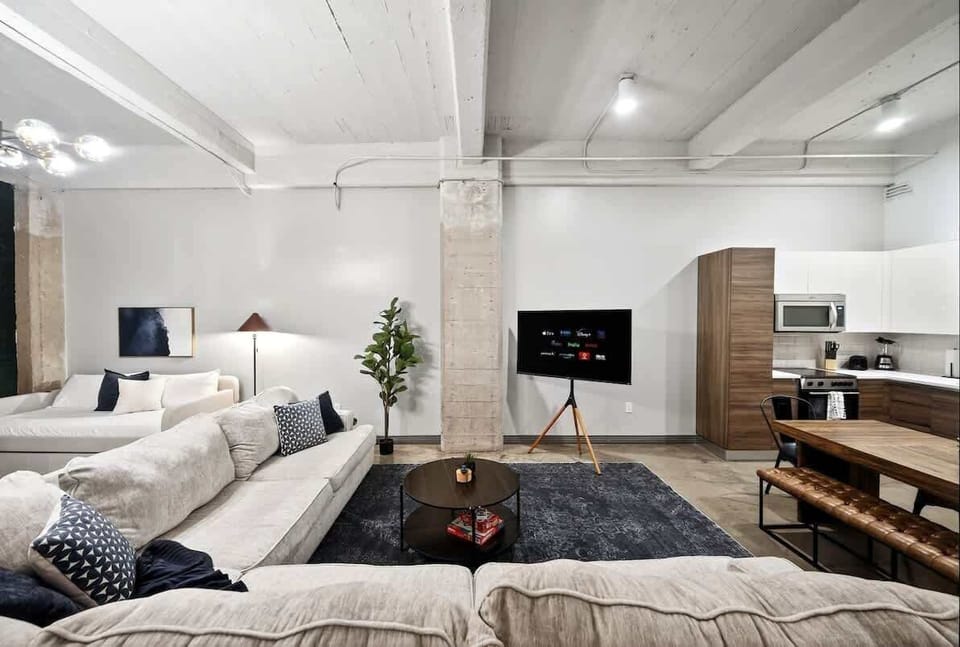 “Relax together” — Stretch out on the spacious sectional, stream your favorite shows, and enjoy the loft’s bright, open vibe