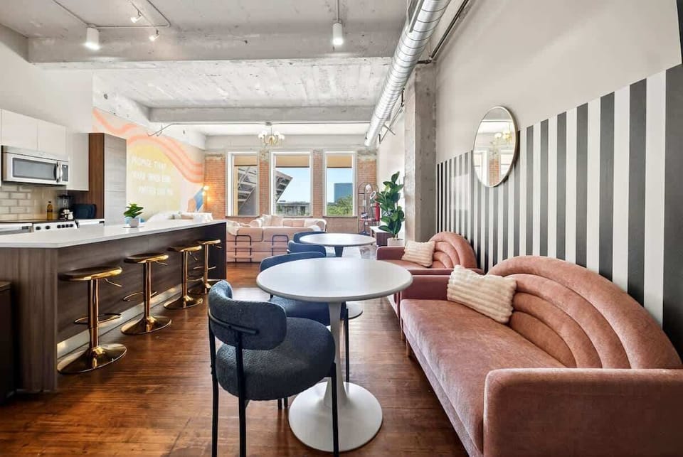 Sunlit & Spacious – exposed brick, high ceilings, and city views create your own urban “Enchanted” backdrop.