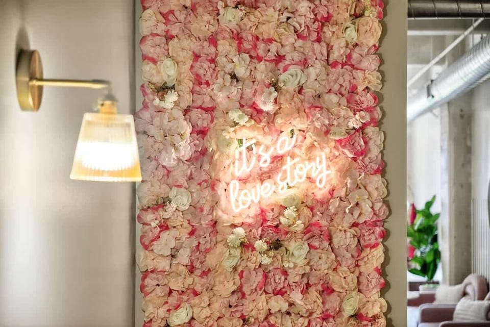 “It’s a Love Story” -a whimsical flower wall perfect for that Instagram moment