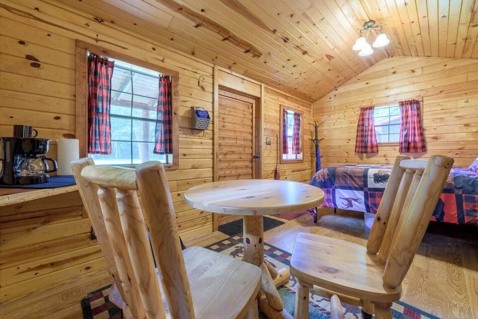CABIN #1:  Cute little woodsy log cabin with a queen-size bed.  Mini-split unit included for heat and A/C.