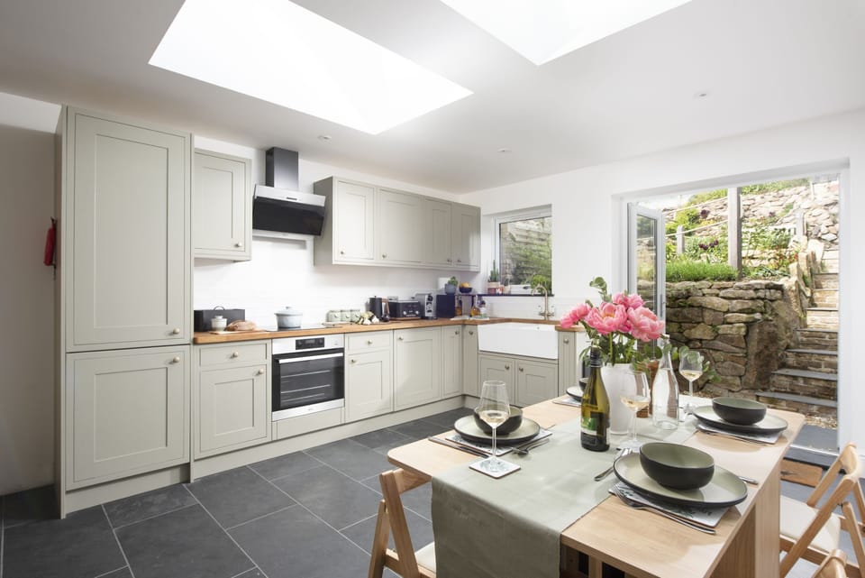 Family kitchen with dining table, fridge/freezer, oven and hob  - Fernbank