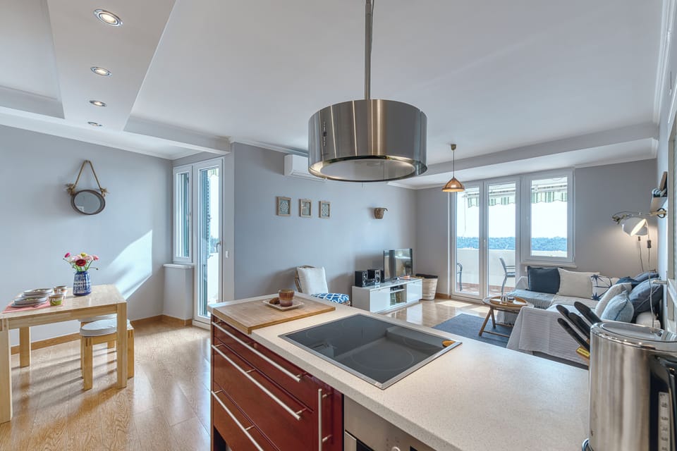 Apartment, Balcony, Sea View | Living area | 43-inch Smart TV with satellite channels