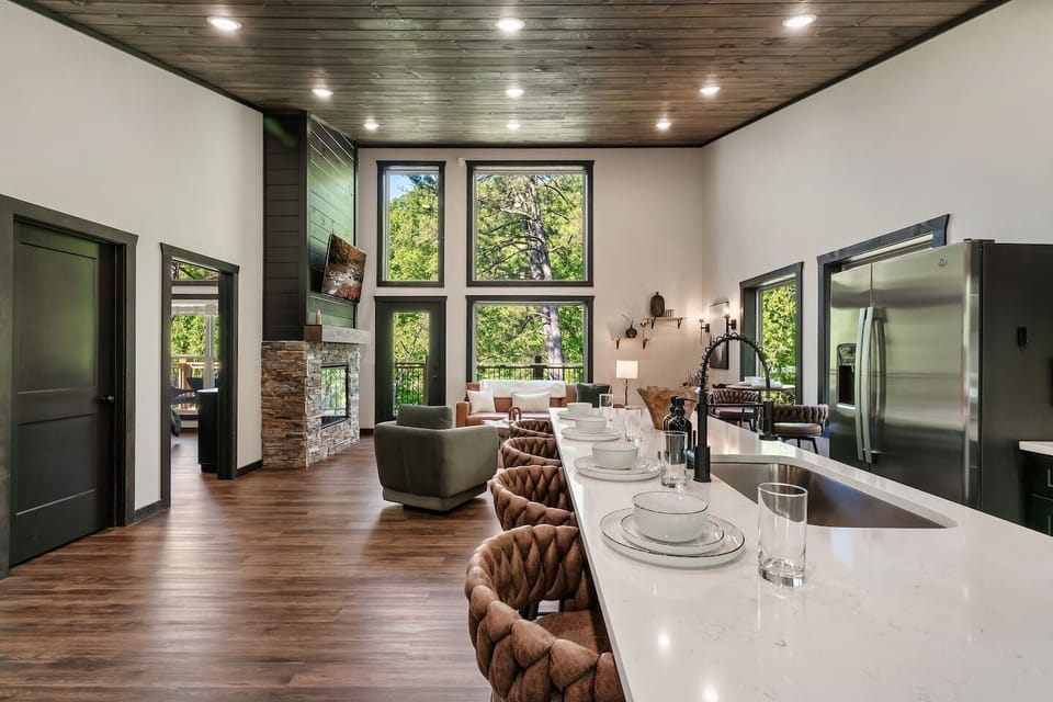 Bright, open mountain retreat filled with natural light and forest views.
