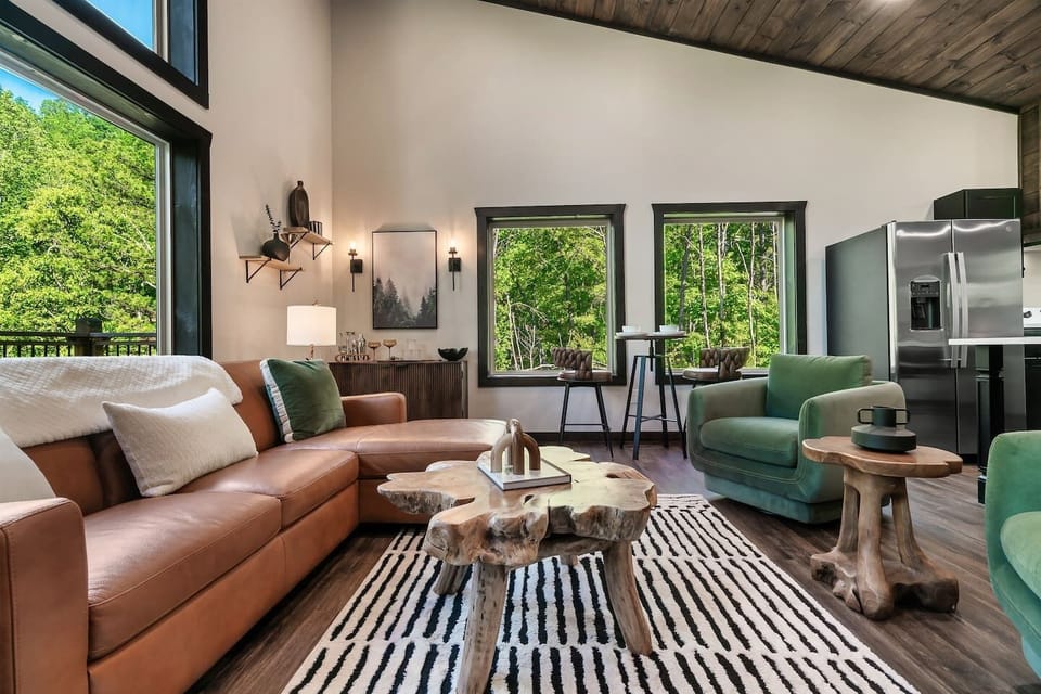Relax in the bright living space surrounded by peaceful Smoky Mountain forest.