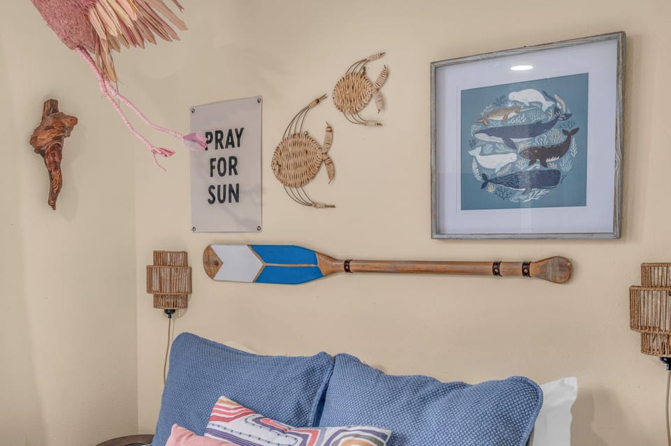 Settle into your cozy coastal retreat, where beach-inspired décor and soft bedding create a laid-back island vibe perfect for unwinding after sun-soaked days.