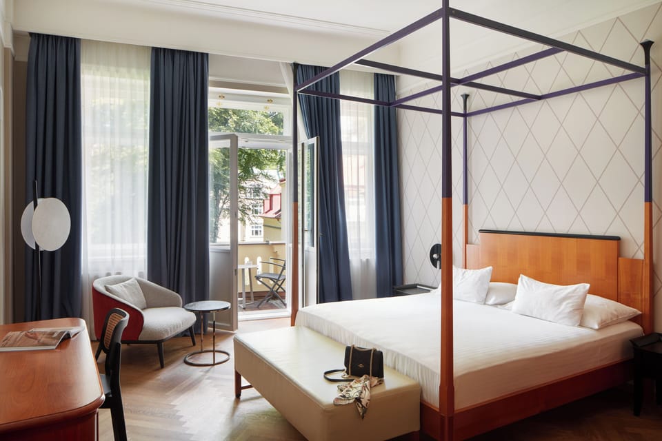 Double Room, Balcony | Minibar, in-room safe, individually decorated, desk
