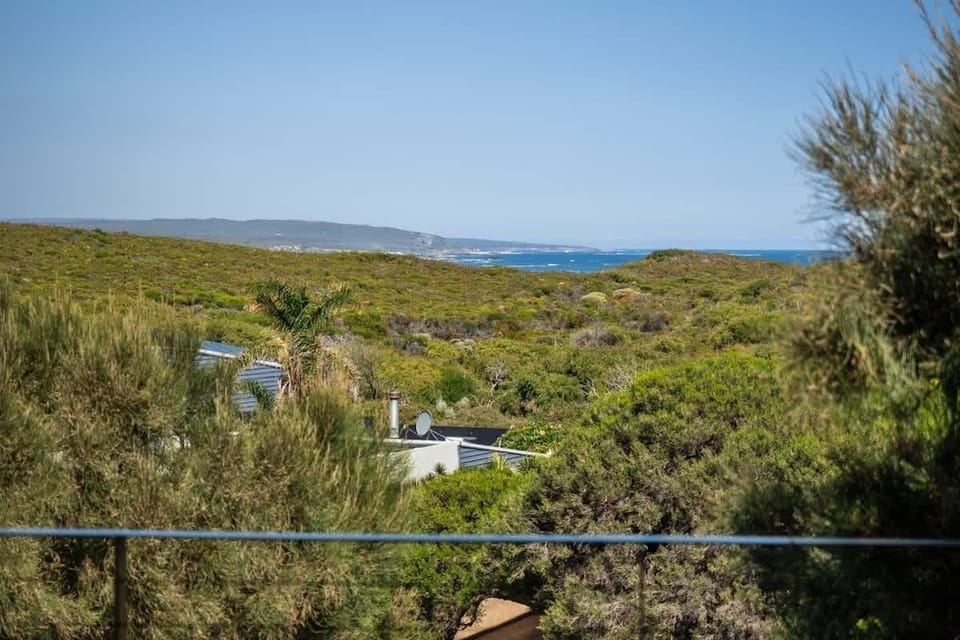 Take in the sweeping outlooks from the main deck, with glimpses of the coastline unfolding beyond the surrounding native landscape.