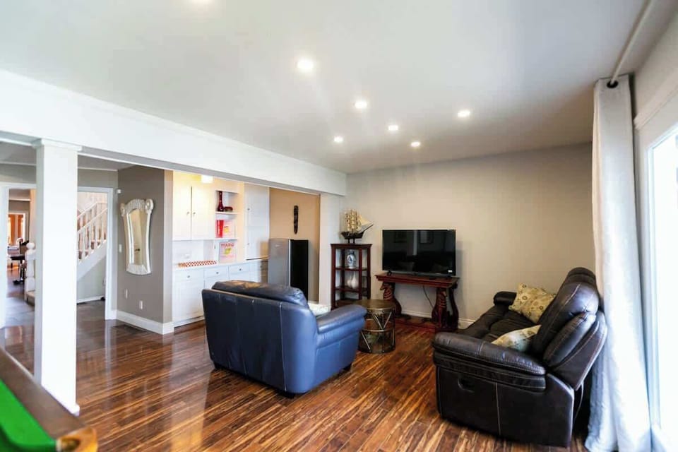 Spacious lounge area perfect for relaxing, movie nights, and gathering together.