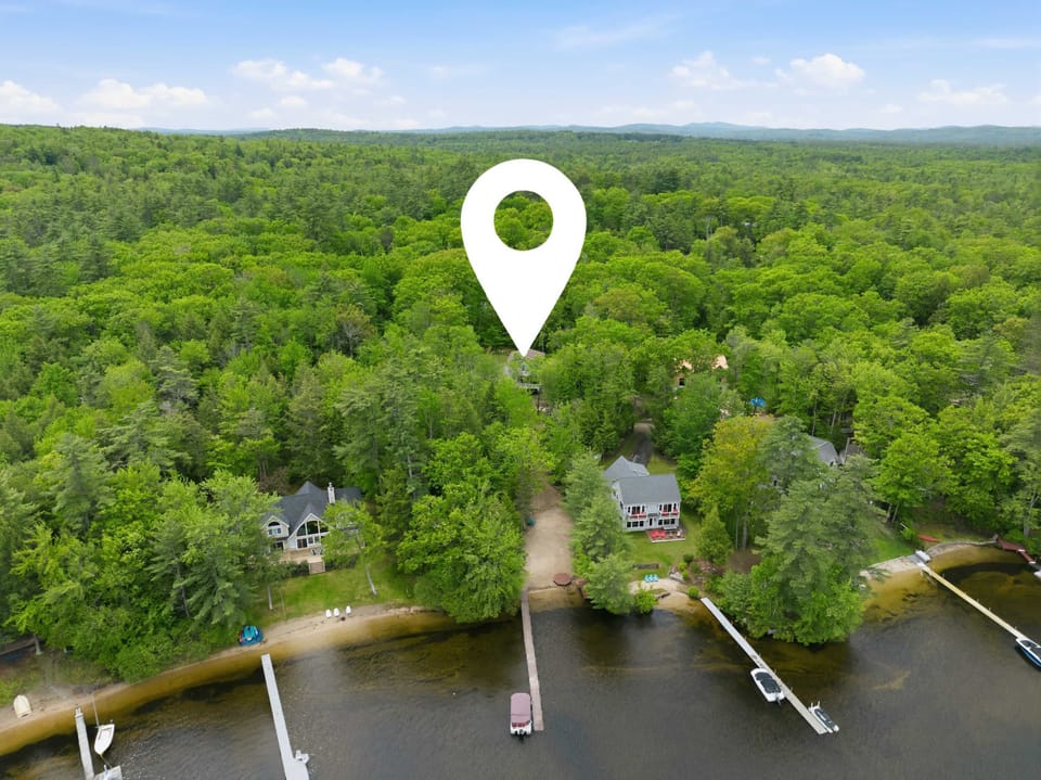 Tucked among the trees, the home offers privacy near the water.