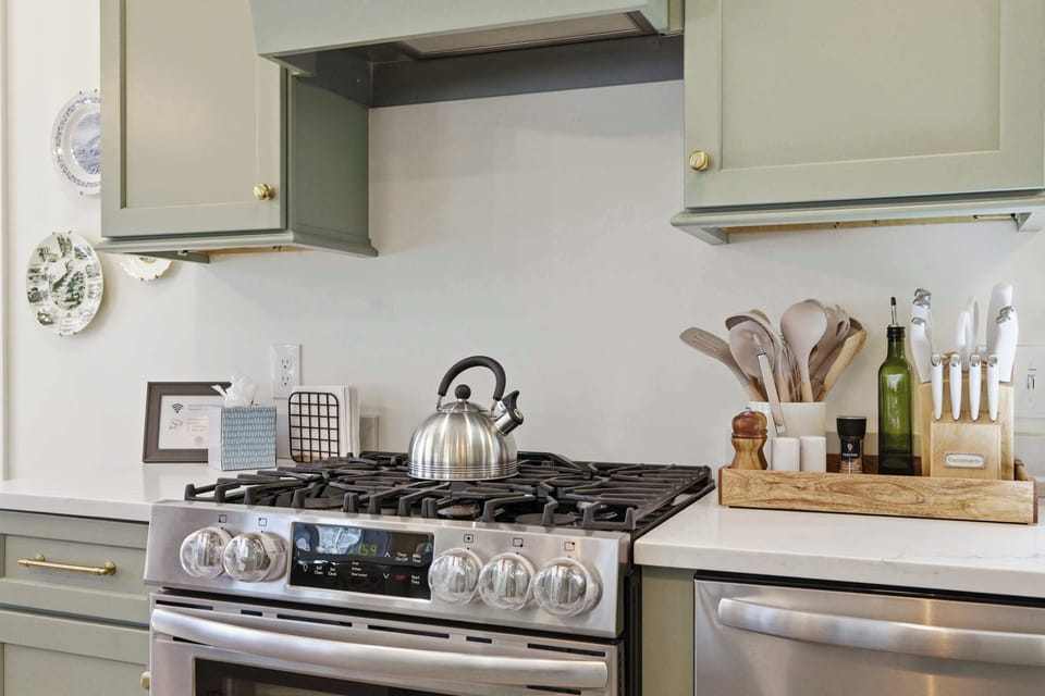 Gas range and stainless appliances ready for a full breakfast or a low-key dinner in — the kitchen earns its place as the heart of the home.