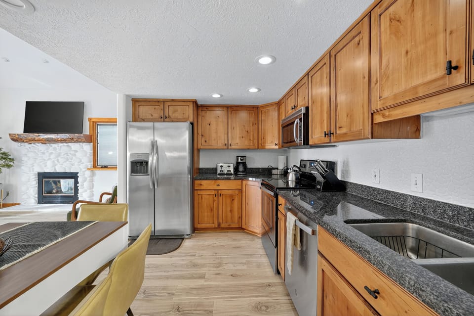 Ample kitchen space open to living room for time together!