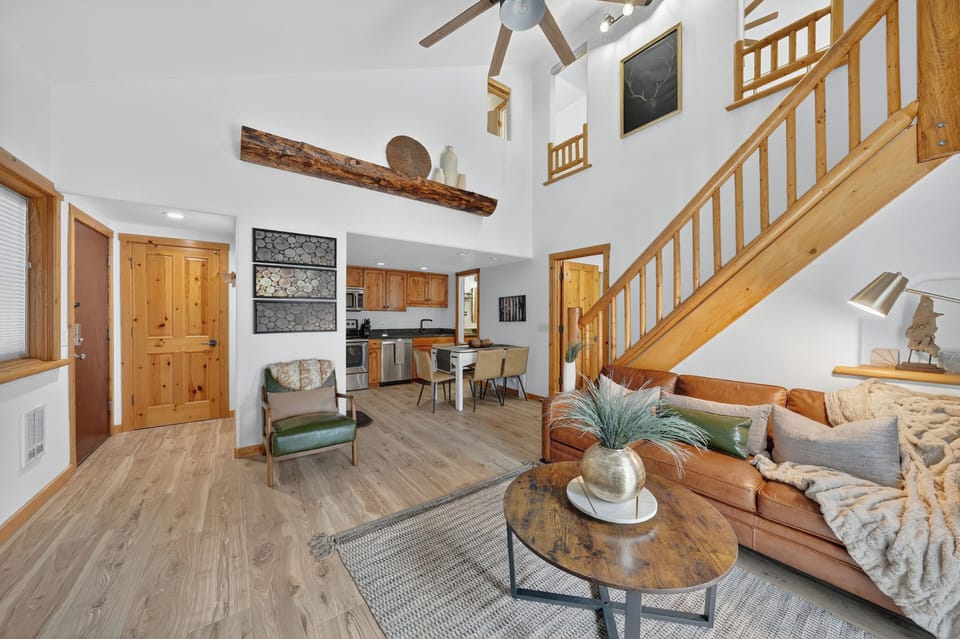 View of entire kitchen, living & dining spaces.