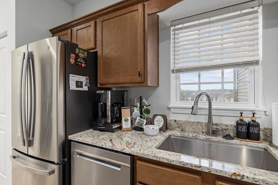 Stainless appliances and a nice big stainless farm sink to help prepare meals together