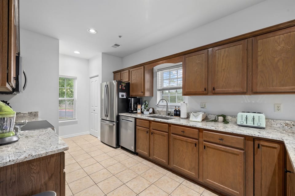 Beautiful spacious kitchen area with lots of counter space and cabinets to store everything you need for cooking
