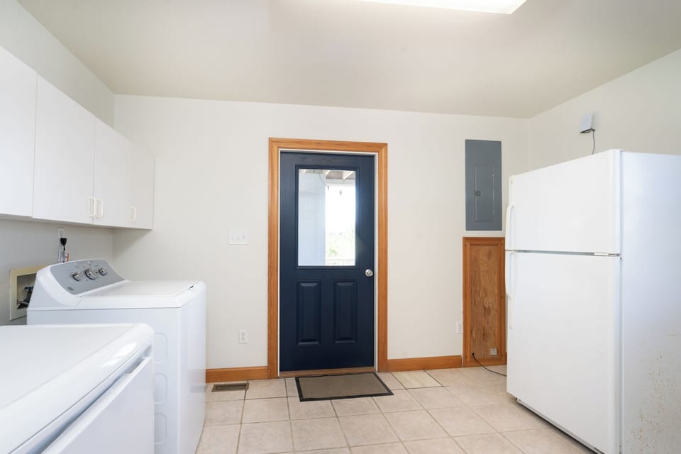 A dedicated laundry space with a full-size washer and dryer keeps your vacation wardrobe fresh, while a full-size refrigerator stores all your favorite snacks and drinks.