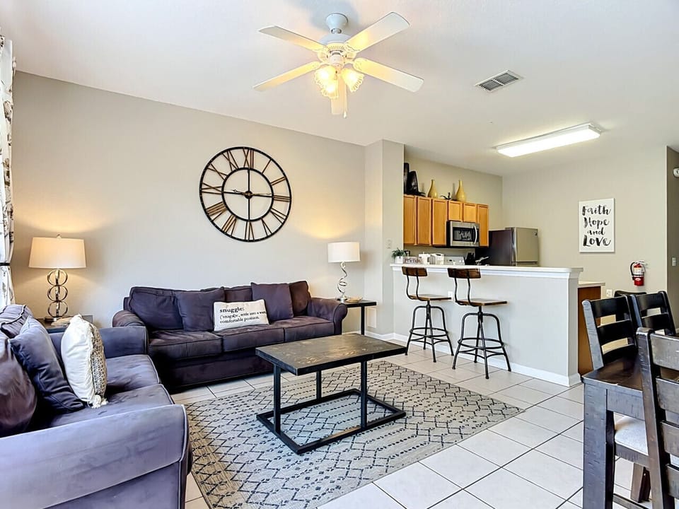 Cozy living room with comfortable seating and open access to the kitchen.