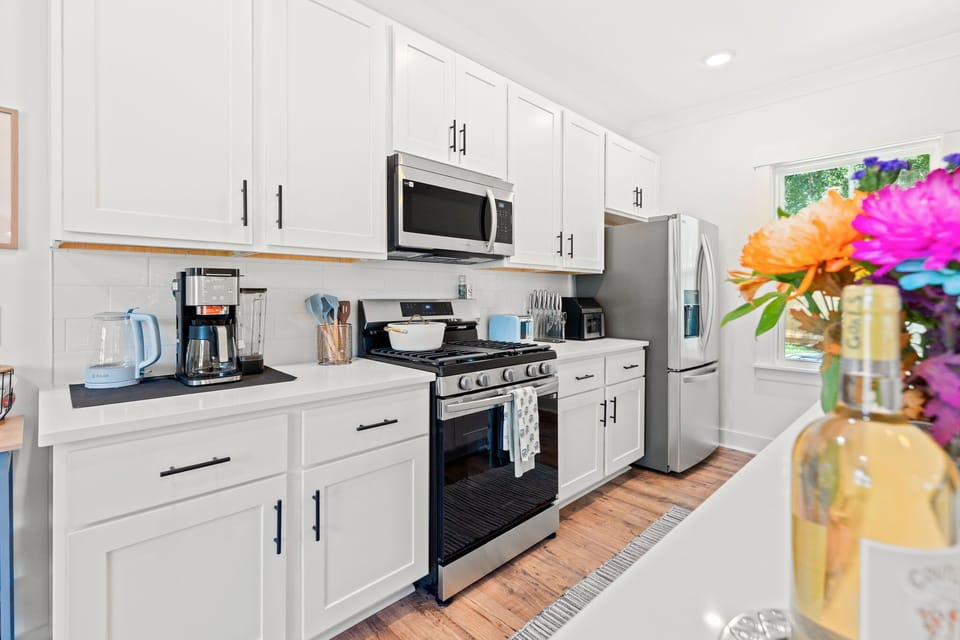 Fully stocked kitchen, with a coffee bar, brand new appliances, and all the items needed to cook the perfect vacation meal :)