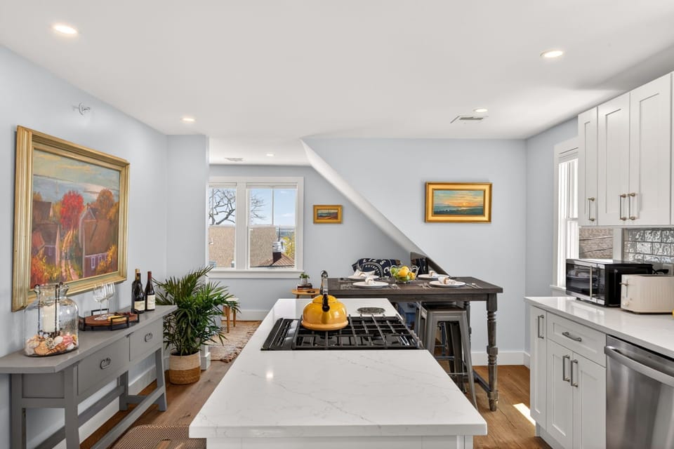 Step into your kitchen, where natural light floods the sleek countertops and modern appliances. Your culinary adventures await with stunning views to inspire every meal.
