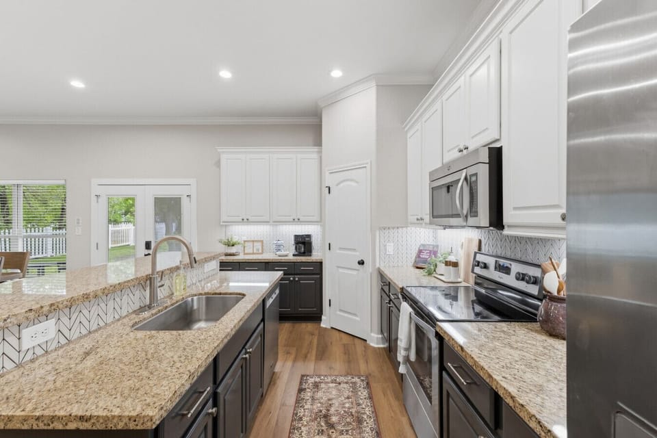 The full kitchen offers plenty of space to meal prep and entertain, inlcuding a full sized oven, electric stovetop, microwave, dishwasher, and refrigerator/freezer.