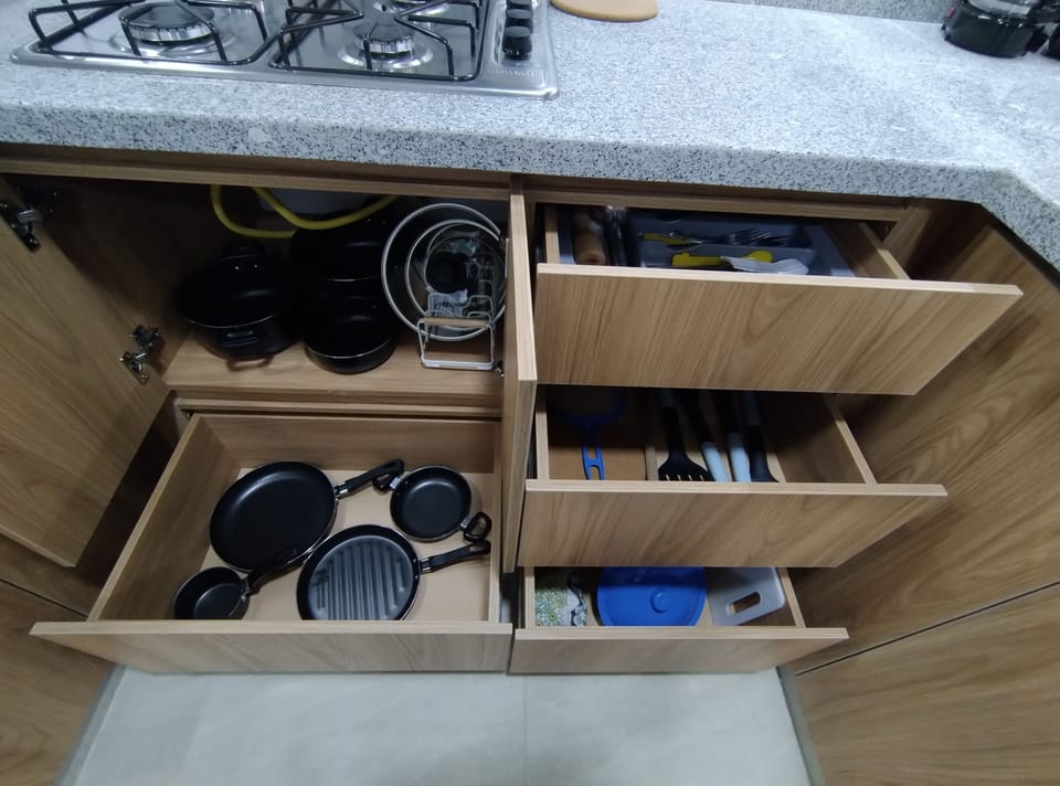 Equipped kitchen with cookware, dishes, and utensils for your meals.