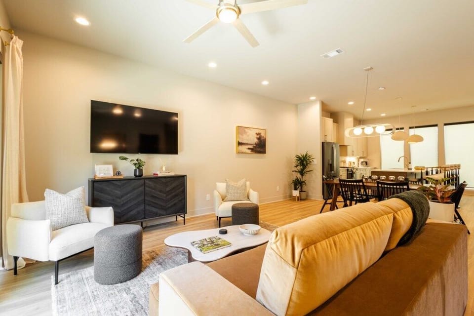 Stylish living room with comfortable seating and modern design including a queen size pullout sofa.