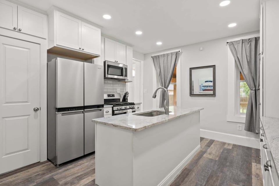 Prep meals with ease at the crisp white kitchen island.