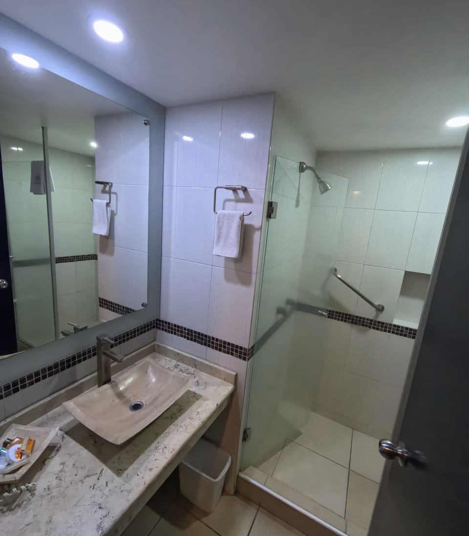 Standard Quadruple Room, 2 Double Beds | Bathroom | Shower, free toiletries, hair dryer, towels