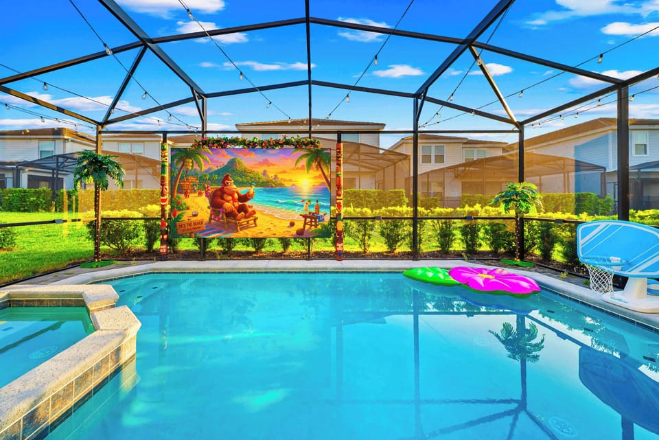 Private screen enclosed lanai with outdoor dining and lounge space. Roku smart projector for epic poolside movie nights. 